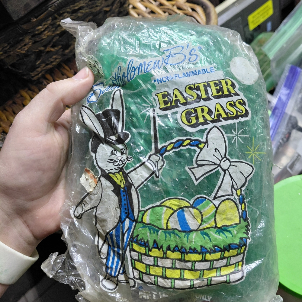 package of green Bartholomew B's Easter Grass used for decorative basket filling